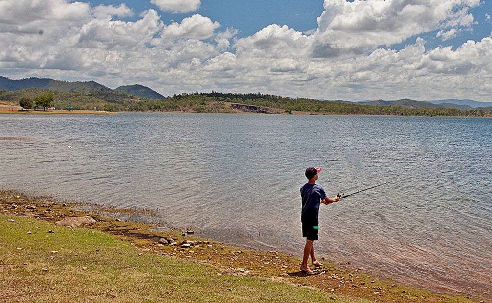 Man fishing at dam
